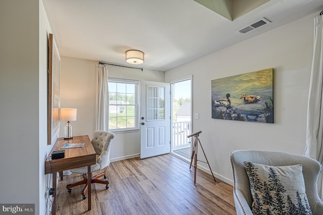 office area with light hardwood / wood-style floors