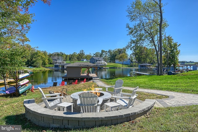 view of patio / terrace featuring a water view and an outdoor fire pit