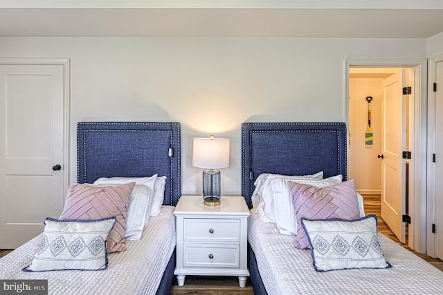 bedroom featuring dark hardwood / wood-style flooring