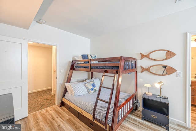 bedroom with light hardwood / wood-style flooring