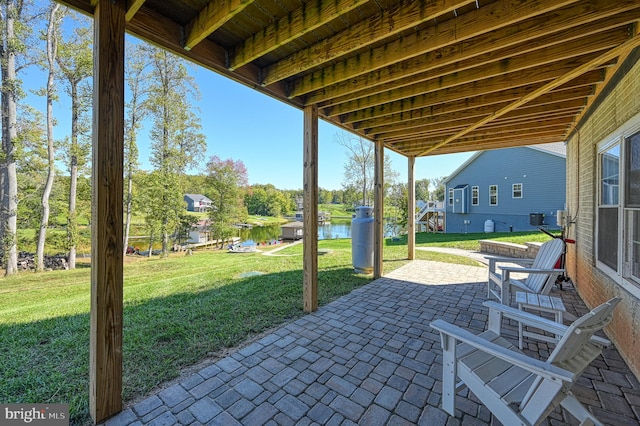 view of patio / terrace with a water view