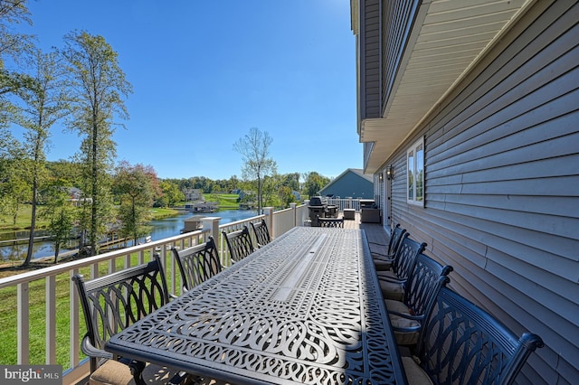 wooden deck featuring a water view