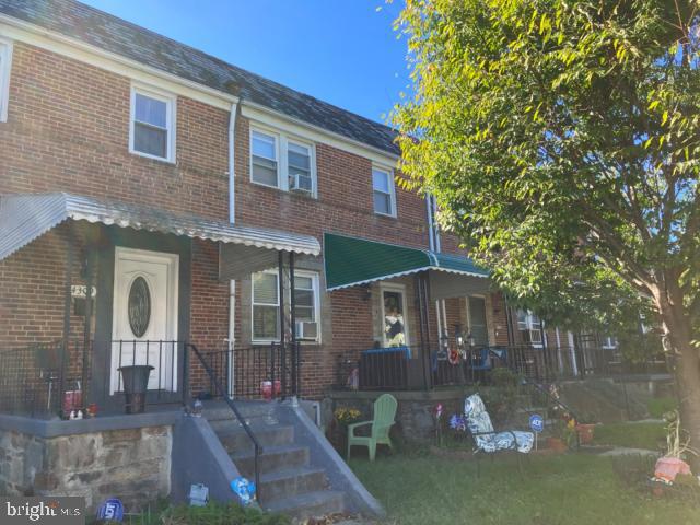 view of property featuring covered porch