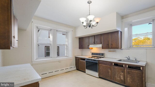 kitchen with white range oven, decorative light fixtures, dark brown cabinetry, a notable chandelier, and a baseboard heating unit