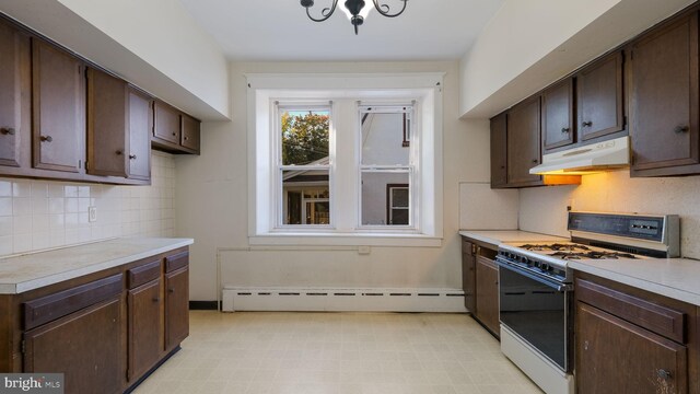 kitchen with tasteful backsplash, dark brown cabinetry, gas range gas stove, a chandelier, and baseboard heating