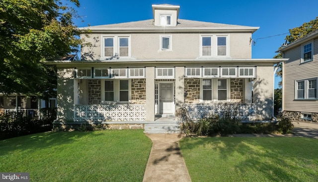 view of front of home featuring a porch and a front lawn