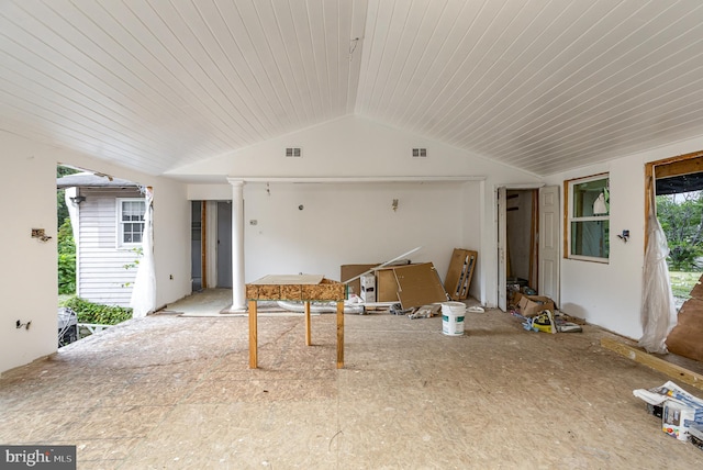 living room featuring vaulted ceiling