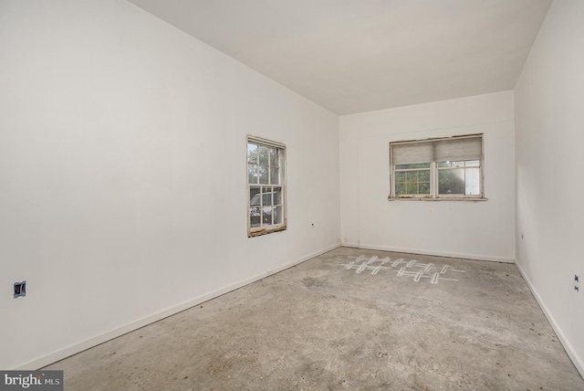 spare room with concrete flooring