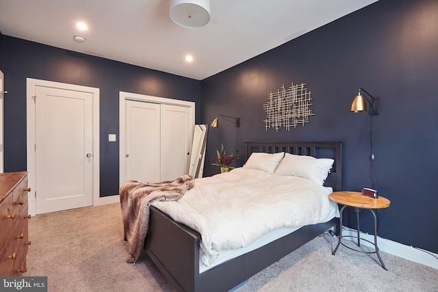 bedroom featuring a closet and carpet flooring