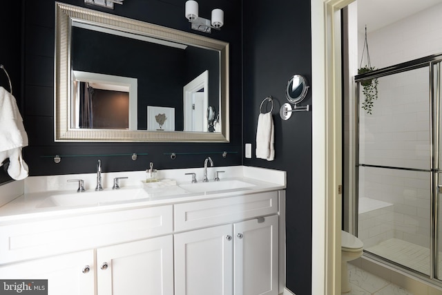 bathroom featuring walk in shower, vanity, and toilet