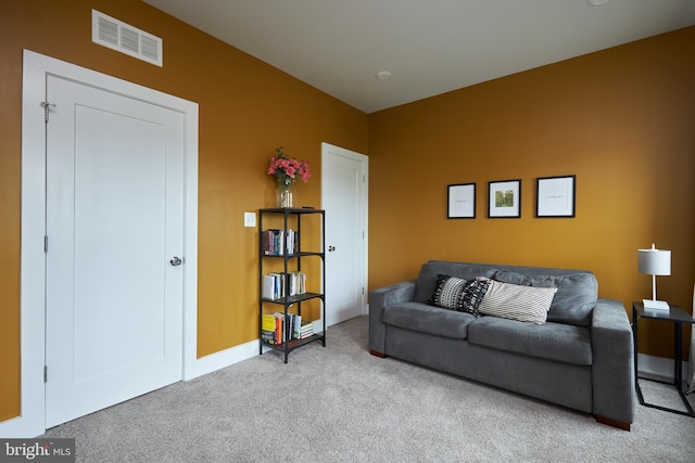 living room featuring light carpet