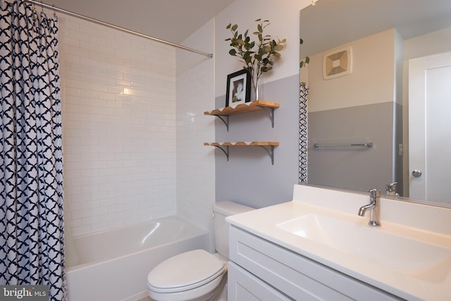 full bathroom featuring vanity, toilet, and shower / tub combo with curtain