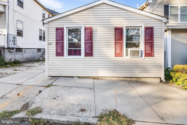 view of property exterior with a patio and cooling unit