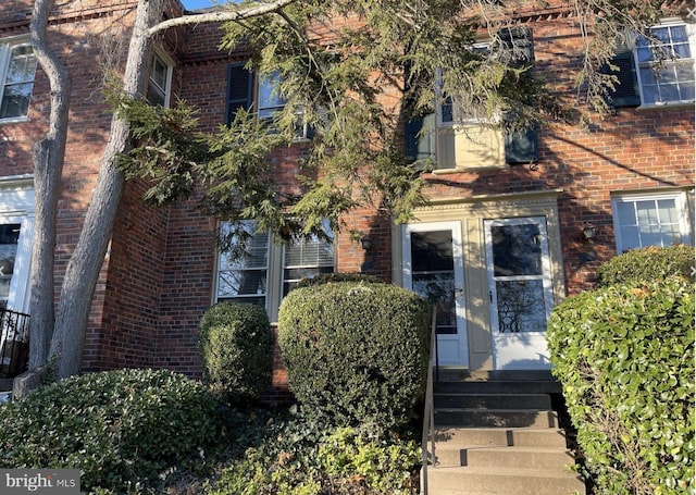 view of front of property featuring brick siding and entry steps