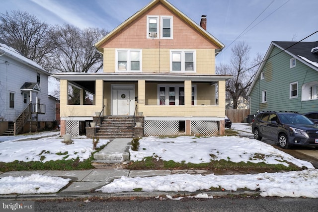 traditional style home featuring covered porch and a chimney