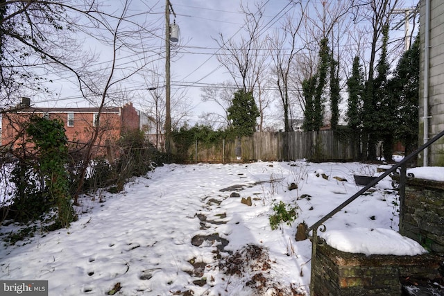 view of yard covered in snow