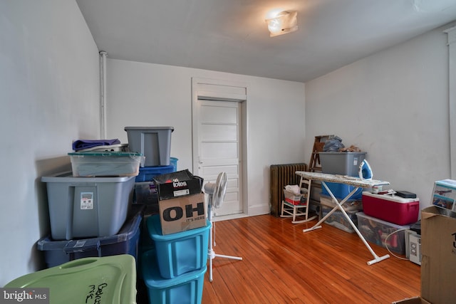 home office with hardwood / wood-style floors