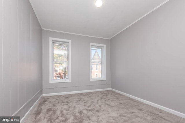 unfurnished room with light colored carpet and ornamental molding