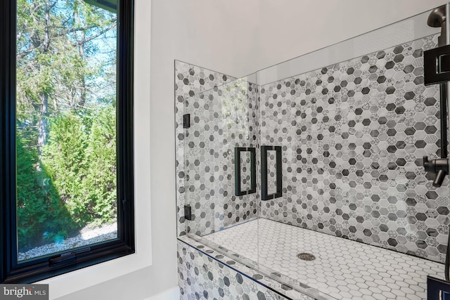 bathroom with a tile shower