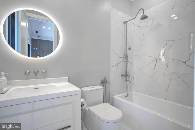 full bathroom with tiled shower / bath, vanity, and toilet