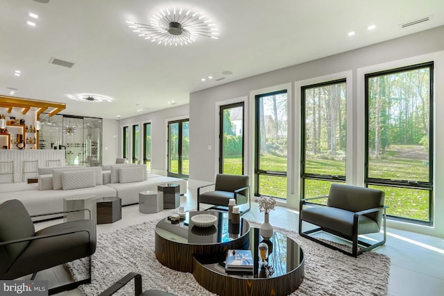 living room featuring visible vents and recessed lighting
