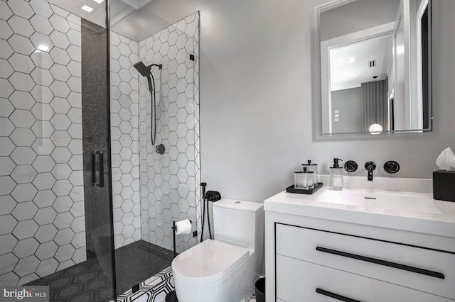 bathroom with vanity, toilet, and an enclosed shower