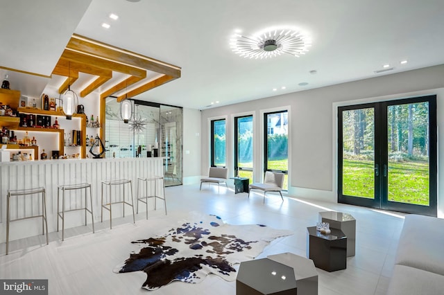 interior space with baseboards, a dry bar, and recessed lighting