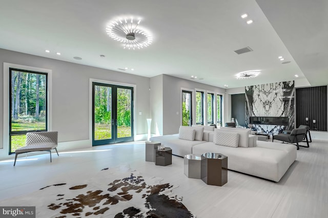 living room with french doors and a fireplace