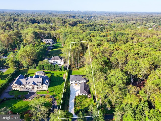 bird's eye view featuring a forest view