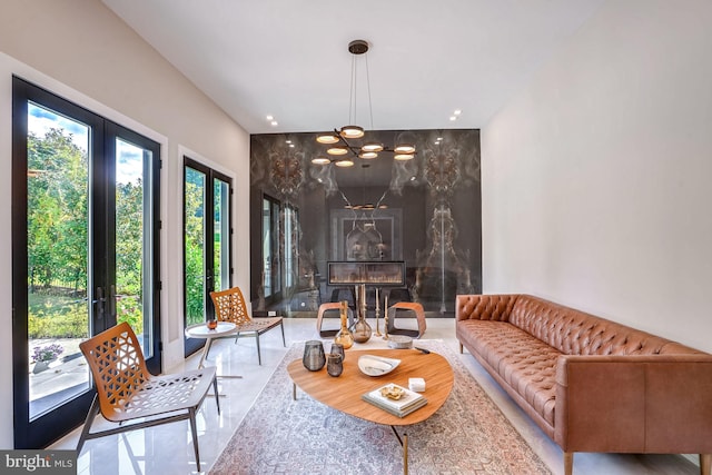 living room featuring a premium fireplace and french doors