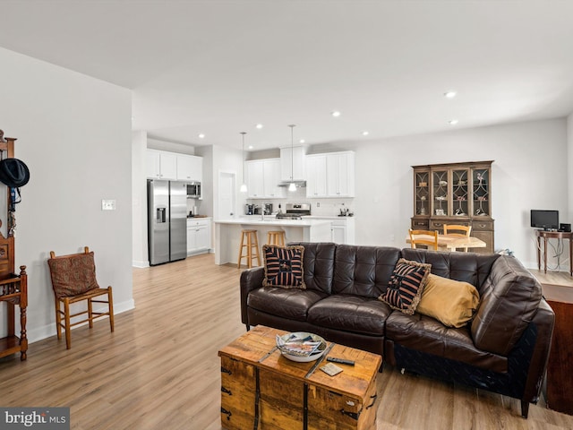 living room with light hardwood / wood-style flooring