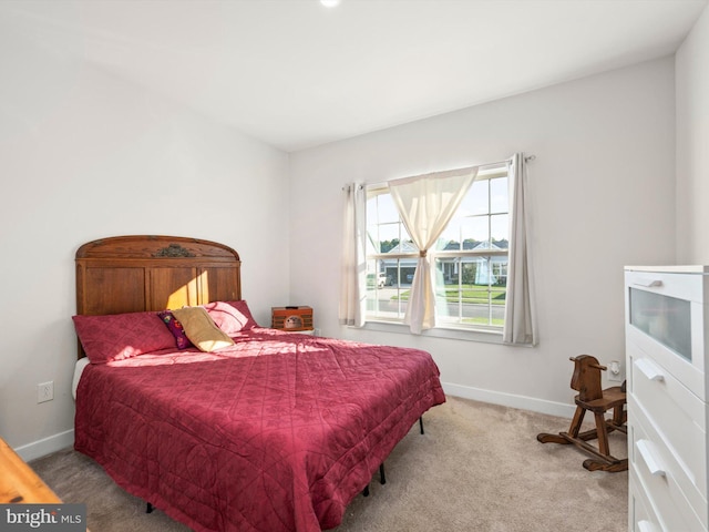 bedroom with light colored carpet