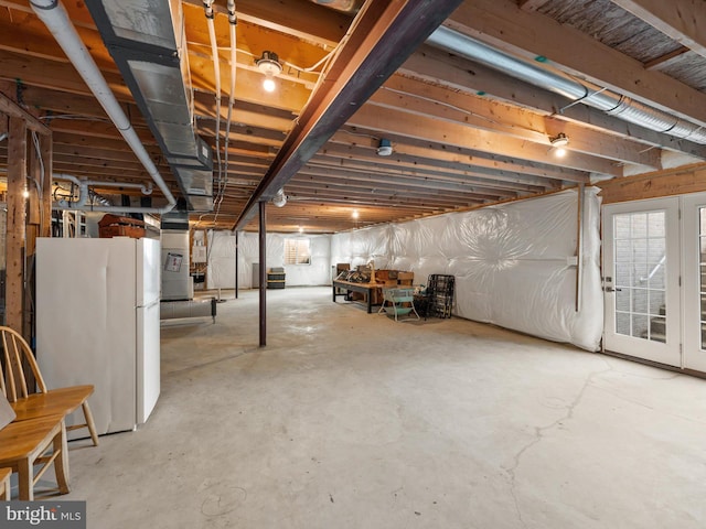 basement with white fridge