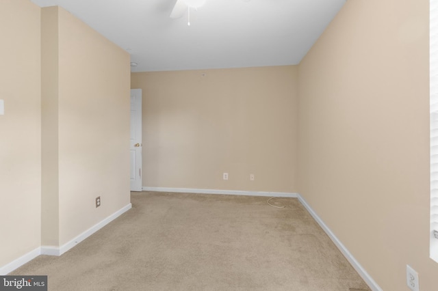 carpeted empty room with ceiling fan