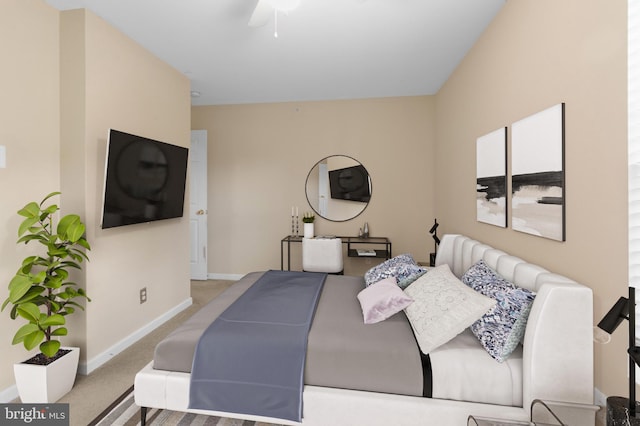 bedroom featuring light carpet and ceiling fan