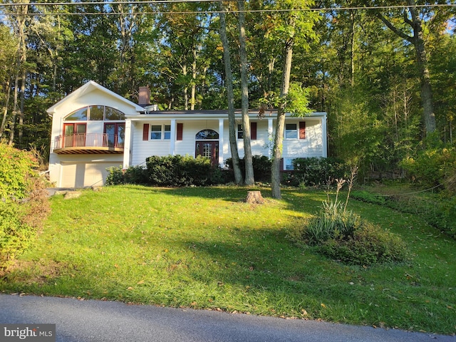 bi-level home with a front lawn