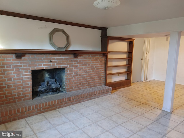 unfurnished living room with a brick fireplace, built in features, and tile patterned flooring