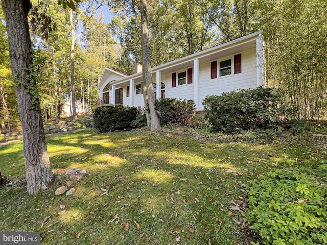 view of front of home with a front lawn