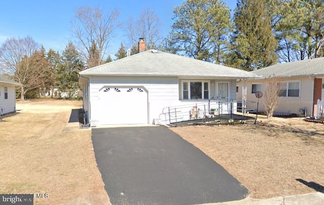 single story home with an attached garage, driveway, and a chimney