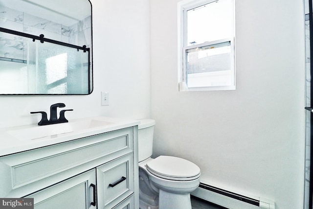 full bath featuring toilet, a shower stall, a baseboard heating unit, and vanity