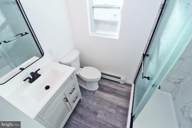 full bathroom featuring a baseboard radiator, toilet, wood finished floors, vanity, and a stall shower