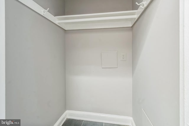 spacious closet featuring tile patterned floors