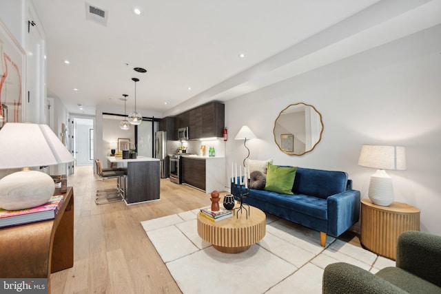 living room with light hardwood / wood-style flooring