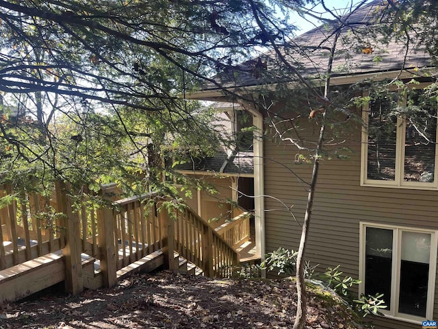 view of side of property featuring a deck