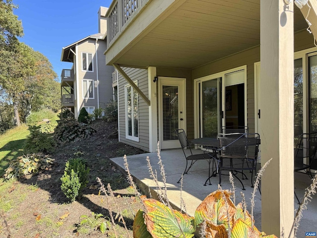 view of patio featuring a balcony