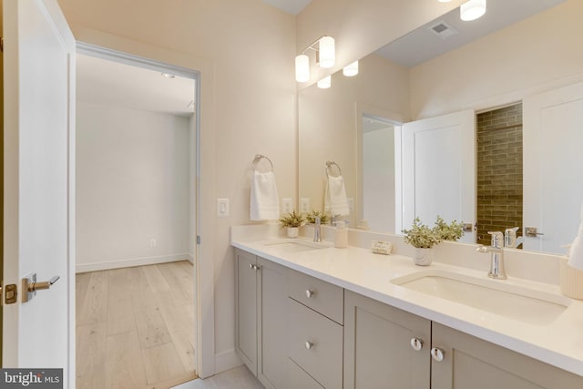 bathroom with vanity and hardwood / wood-style floors