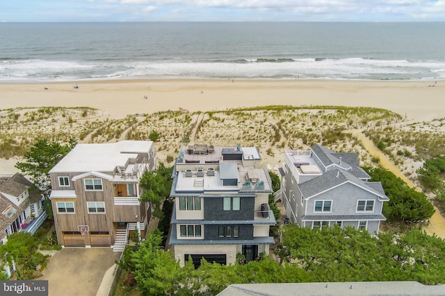 bird's eye view with a water view and a beach view