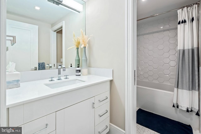 bathroom featuring vanity and shower / bathtub combination with curtain