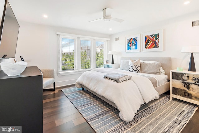 bedroom featuring ceiling fan and dark hardwood / wood-style floors