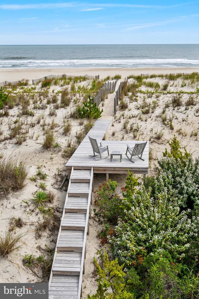 aerial view featuring a beach view and a water view